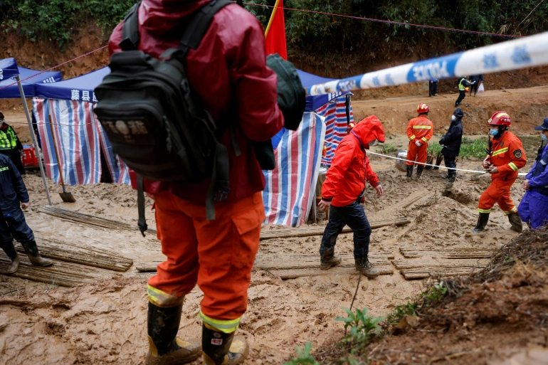 Rescue workers searching after China Eastern Airlines Boeing 737-800 plane crashed in March Image: Reuters