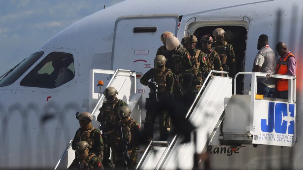 Kenyan police officers, participating in a newly launched security mission, exit their plane upon arrival in Port-au-Prince, Haiti on June 25, 2024. PHOTO | REUTERS