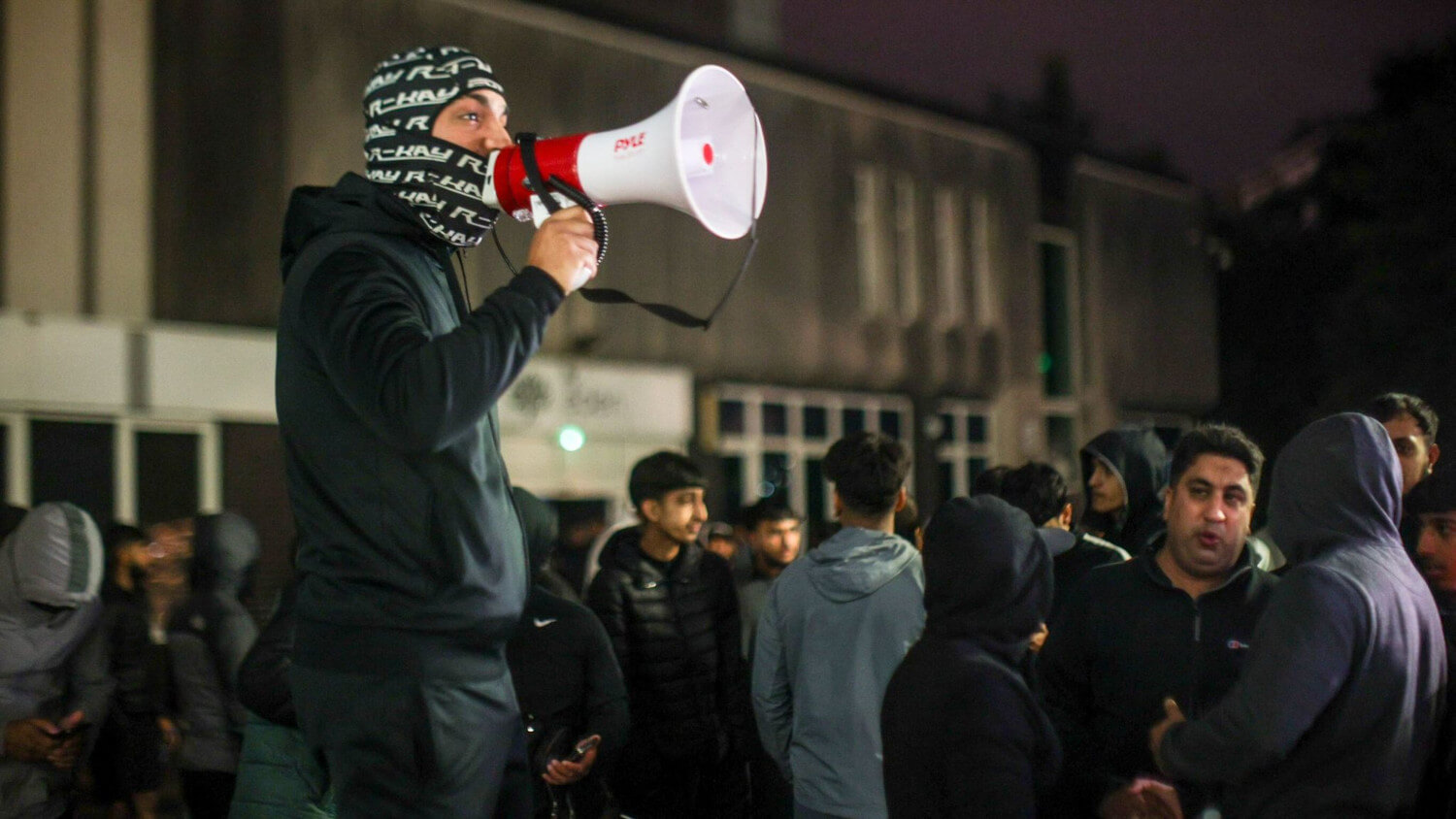 Protesters seen outside Rochdale Police Station.