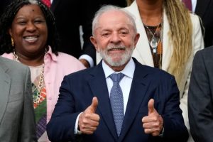 Brazil's President Luiz Inacio Lula da Silva poses for a photo after his first cabinet meeting of 2025, at the Granja do Torto country residence in Brasilia, Brazil, on January 20 [Eraldo Peres/AP Photo]