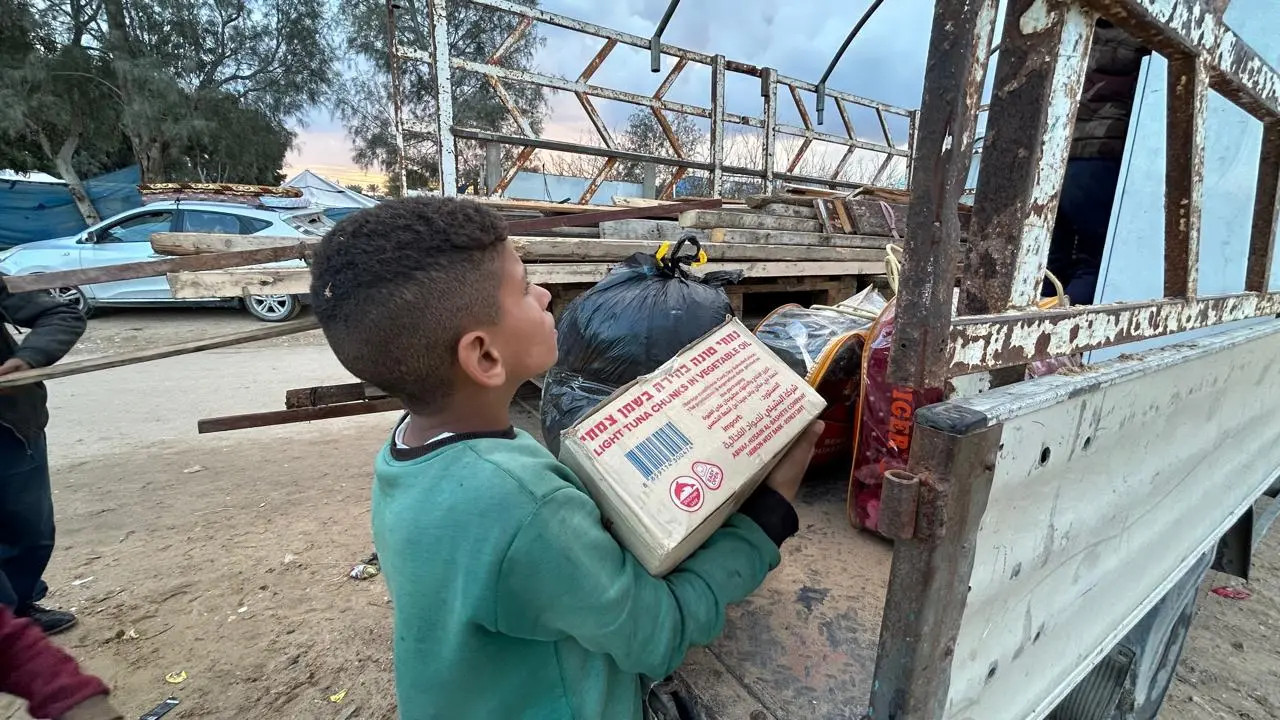 Palestinian families packing their belongings in Khan Younis, southern Gaza, January 27, 2025 [Mohamed Soulaimane/Al Jazeera]