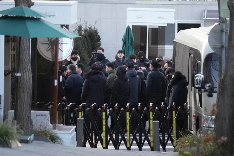 Investigators from the Corruption Investigation Office for High-ranking Officials arrive at the residence of impeached South Korean President Yoon Suk-yeol in Seoul, South Korea, on January 3, 2025 [Lee Jin-man/AP Photo]