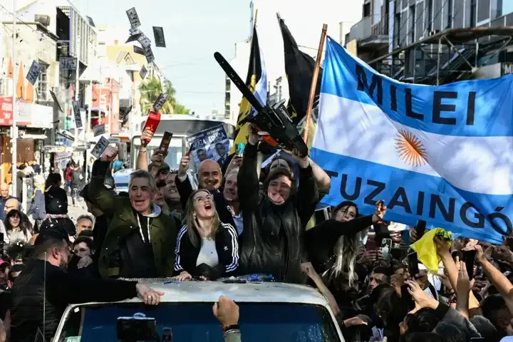 Javier Milei waves a chainsaw during a campaign rally in San Martin, Buenos Aires province, Argentina in September 2023. Photo: LUIS ROBAYO / AFP Source: AFP